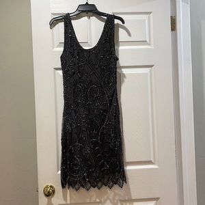 Sequined dark grey dress.